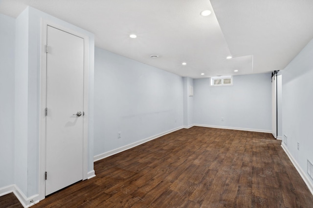 basement with recessed lighting, baseboards, and wood finished floors