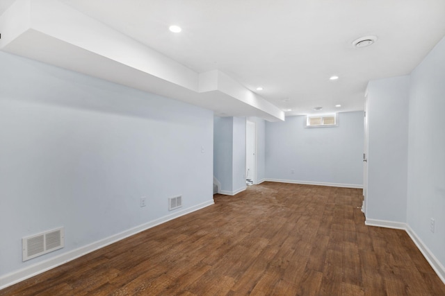 basement with visible vents, recessed lighting, baseboards, and wood finished floors