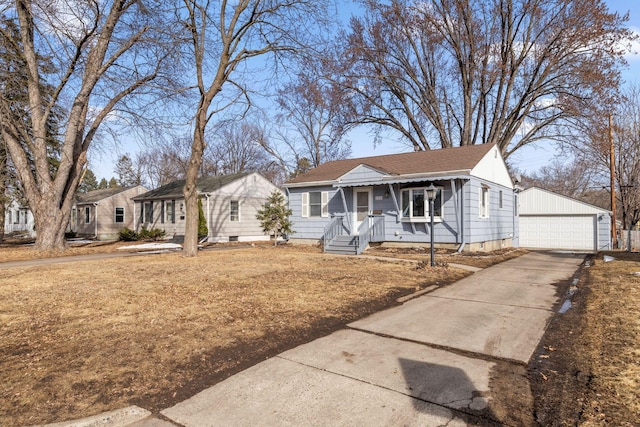 view of front of property with a garage and an outdoor structure