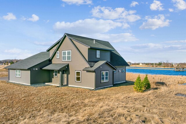 35647 Oxford Ave, Chisago Lake Twp, MN 55012 - rear view of property with roof with shingles and a water view