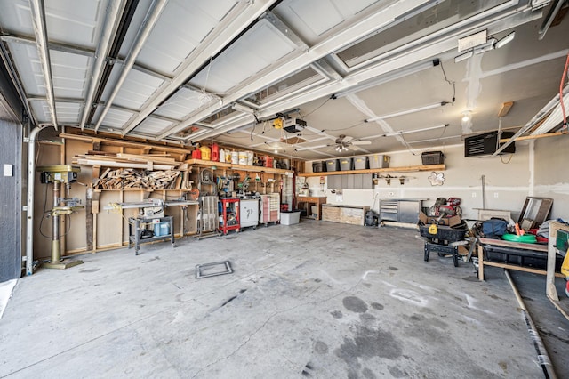35647 Oxford Ave, Chisago Lake Twp, MN 55012 - garage with a garage door opener, a workshop area, and a heating unit