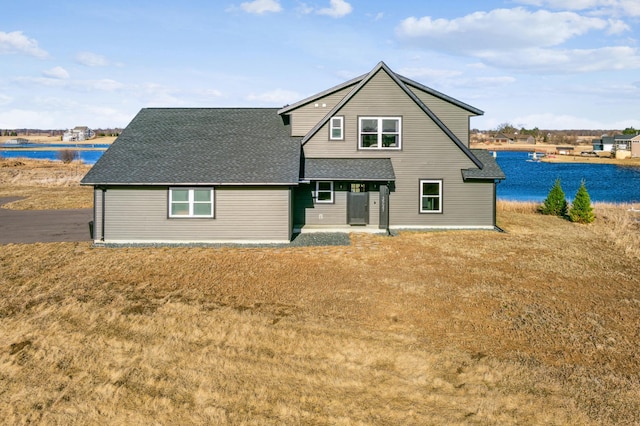35647 Oxford Ave, Chisago Lake Twp, MN 55012 - back of property featuring a shingled roof, a water view, and a lawn