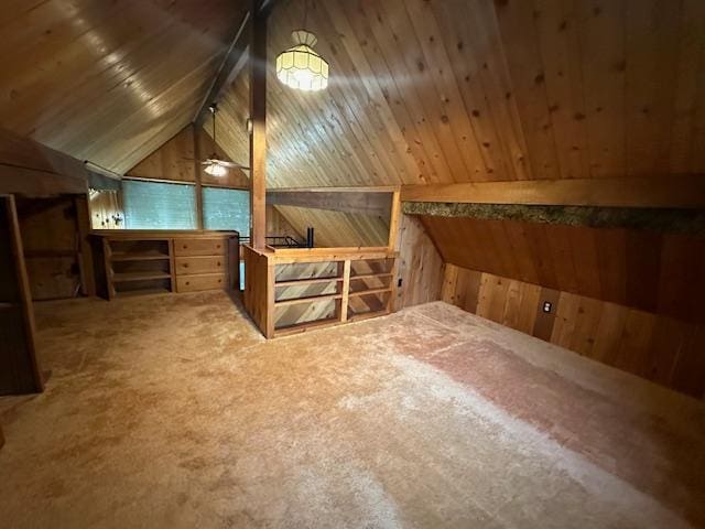 bonus room featuring vaulted ceiling, wooden walls, carpet flooring, and wooden ceiling