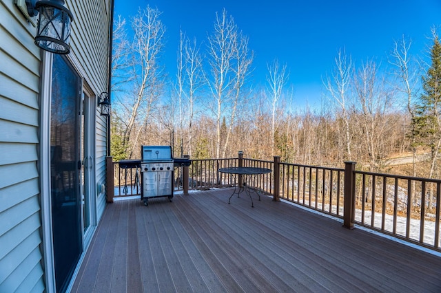 deck featuring a grill