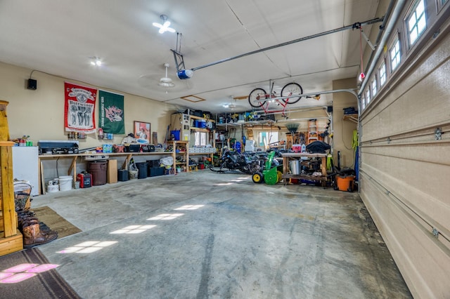 garage featuring a workshop area and a garage door opener