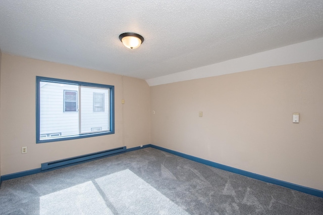 carpeted empty room featuring baseboard heating, a textured ceiling, lofted ceiling, and baseboards