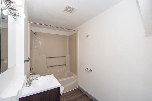 bathroom featuring visible vents, toilet, shower / tub combination, wood finished floors, and vanity