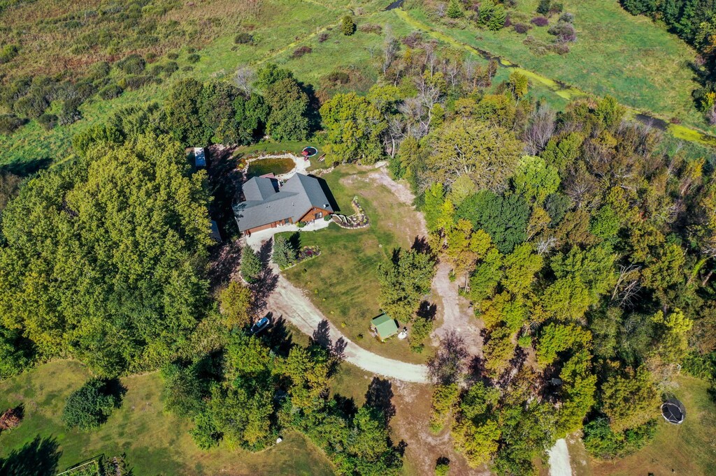 9405 201st Ct W, Faribault, MN 55021 - drone / aerial view featuring a wooded view