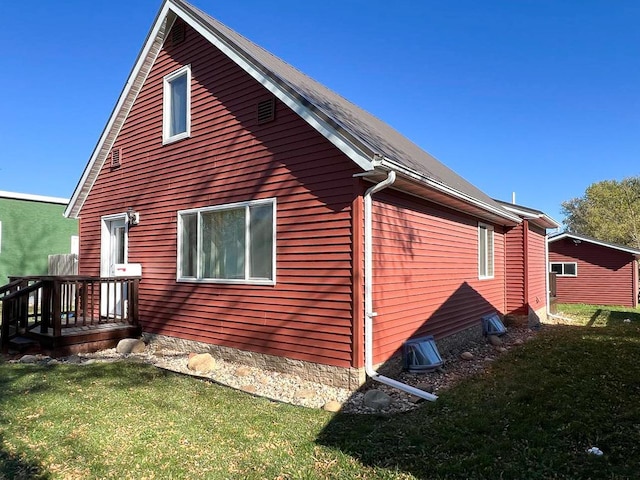 view of property exterior featuring a yard