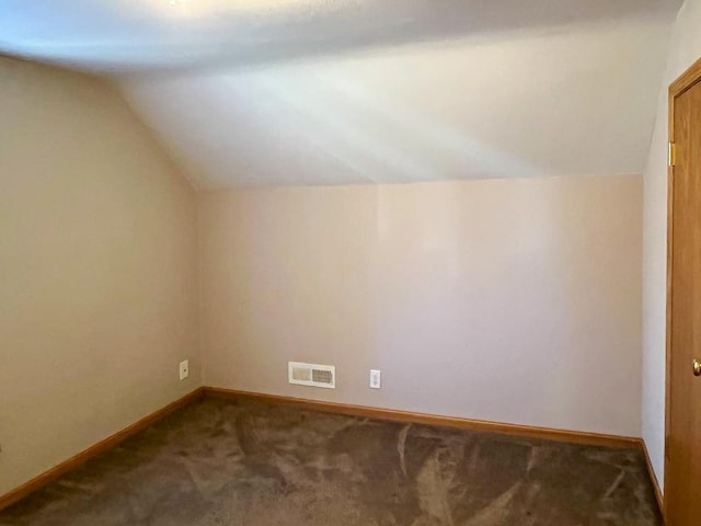 bonus room featuring visible vents, baseboards, lofted ceiling, and carpet floors