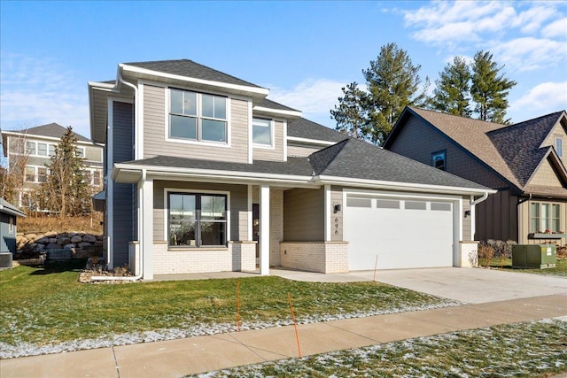 view of front of home with driveway, a porch, a shingled roof, a garage, and brick siding