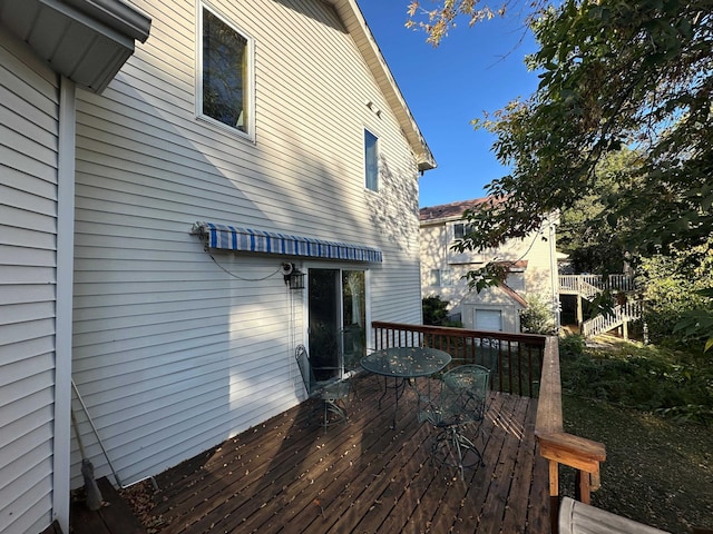 deck featuring outdoor dining area