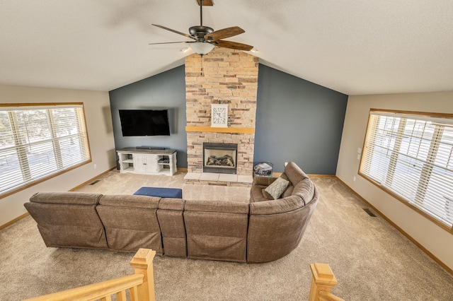 living area featuring light colored carpet, a fireplace, and vaulted ceiling