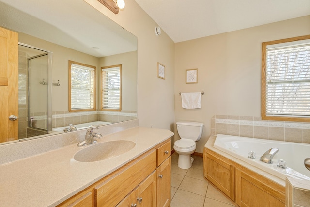 full bathroom with tile patterned flooring, a stall shower, toilet, and a garden tub