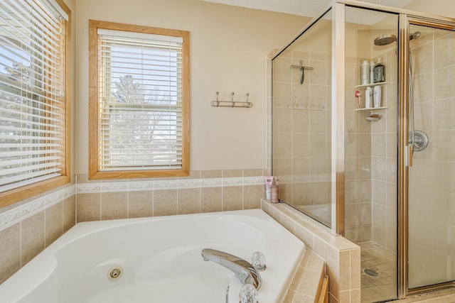 full bathroom featuring a stall shower and a bath