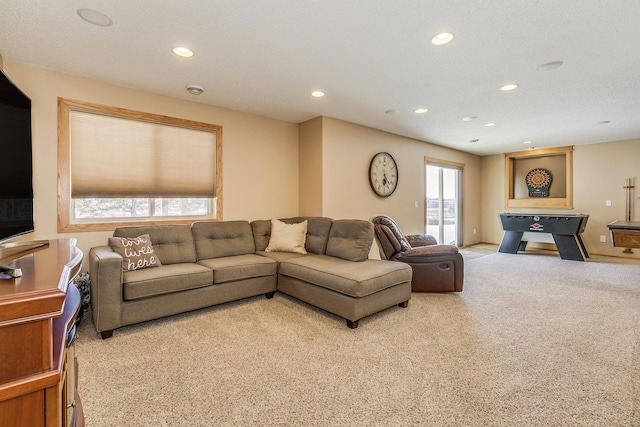 carpeted living area featuring recessed lighting