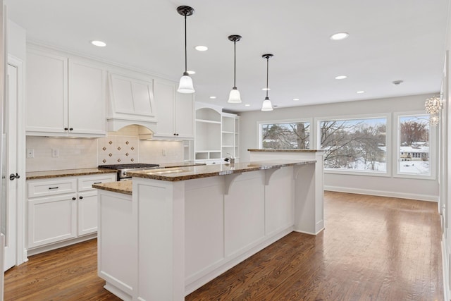 kitchen with white cabinets, tasteful backsplash, and dark wood-style flooring