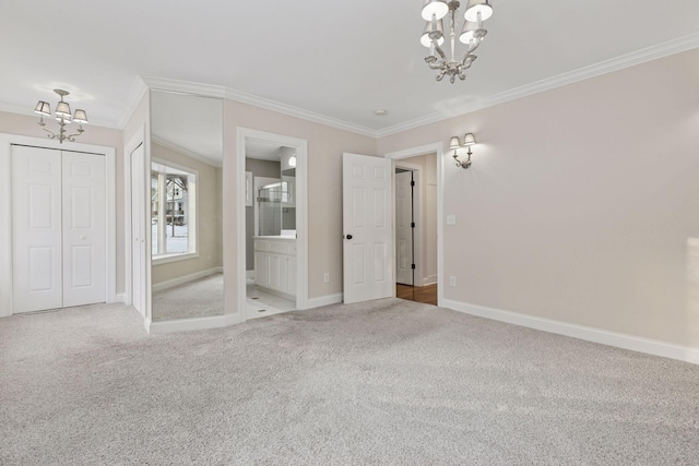 unfurnished bedroom featuring an inviting chandelier, carpet flooring, and crown molding