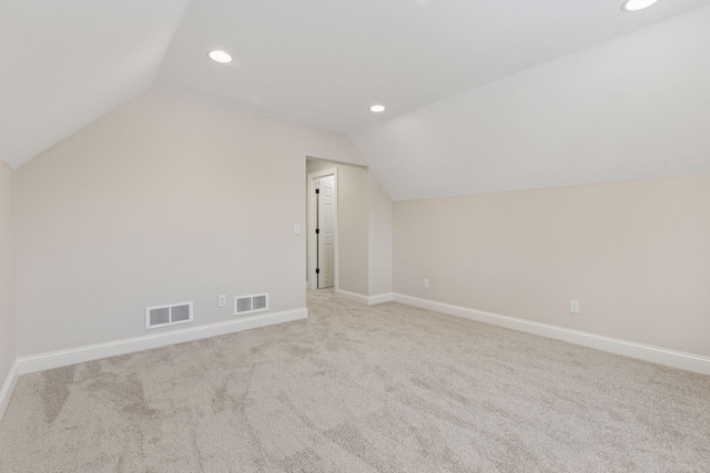 additional living space featuring vaulted ceiling, recessed lighting, baseboards, and visible vents