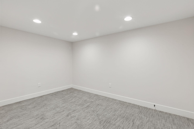 unfurnished room with recessed lighting, baseboards, and carpet floors