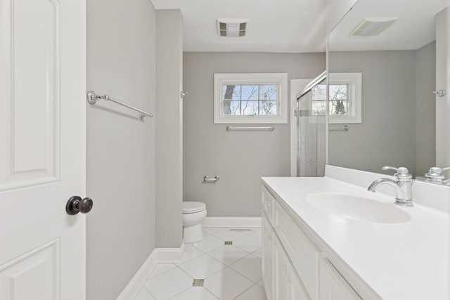 bathroom featuring baseboards, visible vents, an enclosed shower, tile patterned floors, and toilet