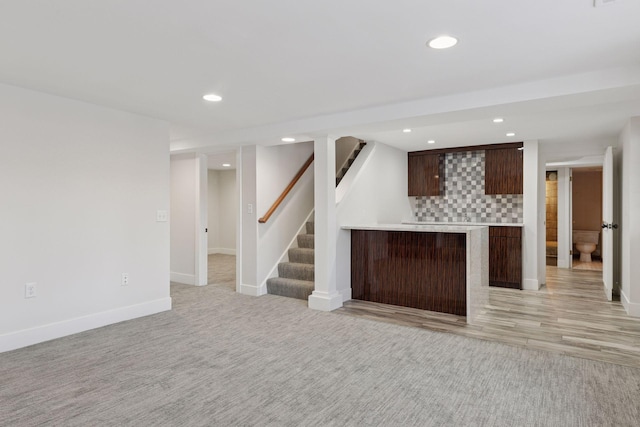 interior space with recessed lighting, stairway, light carpet, and baseboards