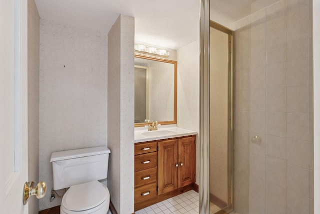 full bathroom featuring vanity, toilet, a stall shower, and tile patterned flooring