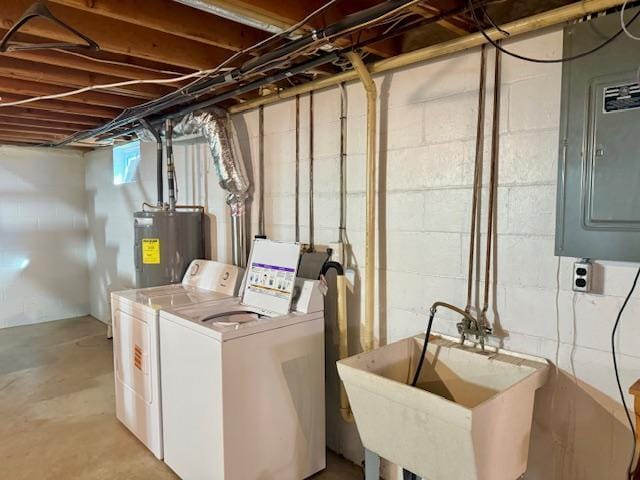 basement featuring electric panel, washing machine and dryer, water heater, and a sink