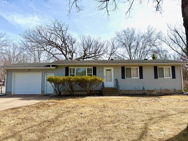 ranch-style house with concrete driveway, an attached garage, and entry steps