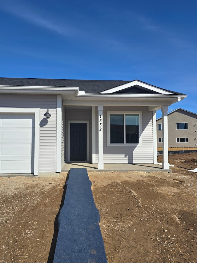 view of front of house with roof with shingles