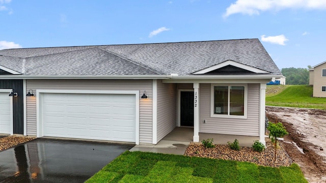 1332 Rose St, New Richmond, WI 54017 - single story home featuring a garage, roof with shingles, and driveway