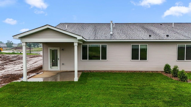 1332 Rose St, New Richmond, WI 54017 - rear view of house with a patio area, a lawn, and a shingled roof