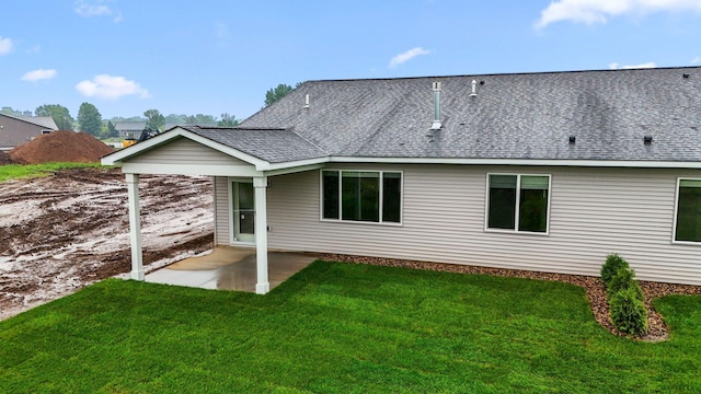 1332 Rose St, New Richmond, WI 54017 - back of property featuring a patio area, a lawn, and roof with shingles