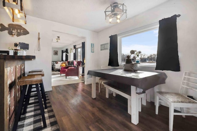 dining area featuring wood finished floors and baseboards