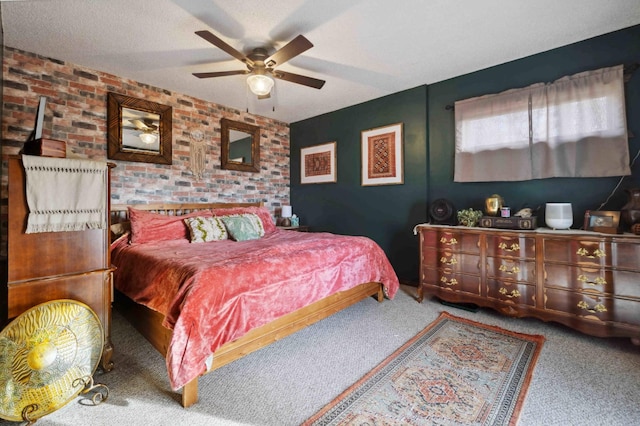 bedroom with a textured ceiling, brick wall, ceiling fan, and carpet flooring