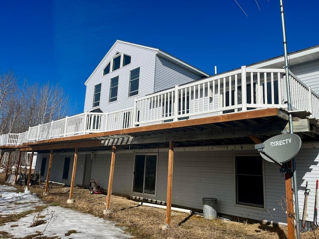 back of house featuring a deck