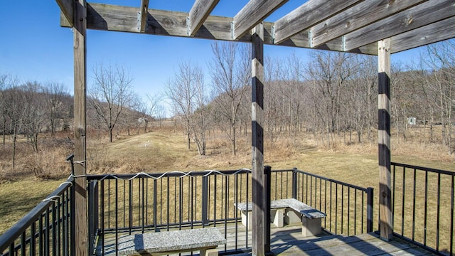 wooden deck with a lawn