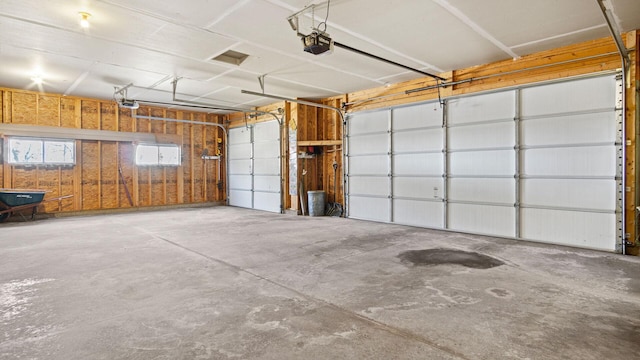 garage featuring a garage door opener