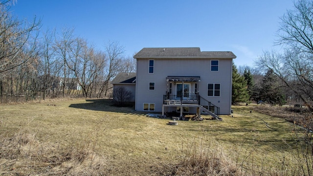 back of house featuring a yard