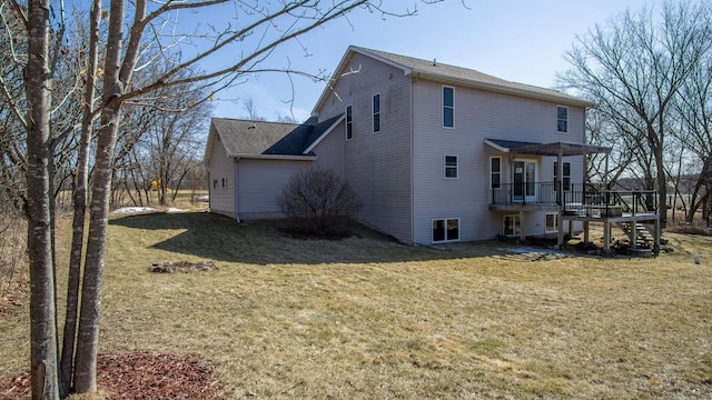 back of house with a deck, stairway, and a lawn