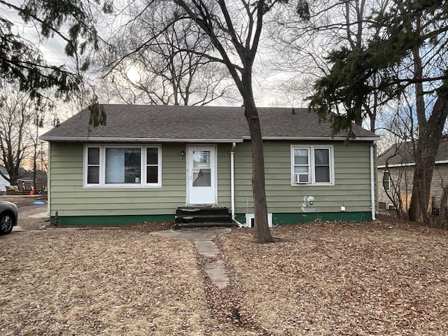 view of front of property with entry steps and roof with shingles