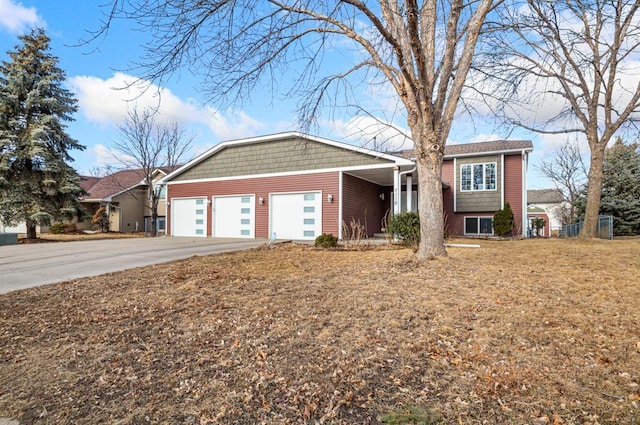 view of front of property with an attached garage and concrete driveway