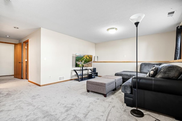 living room with visible vents, baseboards, and carpet floors