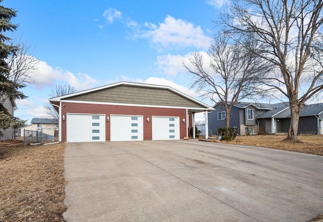 view of front of home with fence and driveway