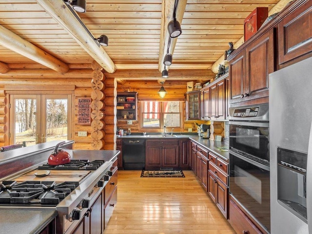 kitchen with black appliances, wood ceiling, light wood finished floors, and beam ceiling