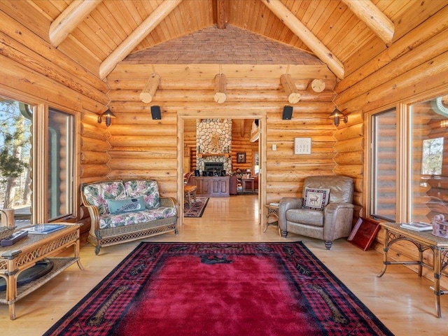 living room featuring wooden ceiling, wood finished floors, and high vaulted ceiling