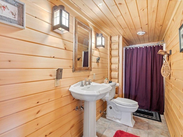 full bathroom featuring wood walls, wooden ceiling, toilet, and a shower with shower curtain