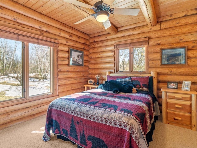 bedroom with beam ceiling, wood ceiling, and rustic walls