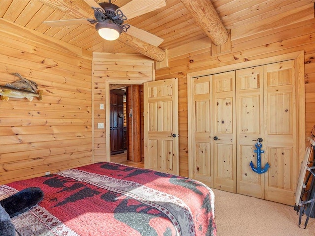 bedroom with beamed ceiling, wood ceiling, wood walls, and carpet flooring