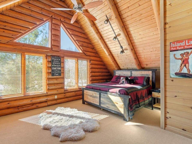 bedroom featuring wood ceiling, carpet floors, beam ceiling, rail lighting, and rustic walls